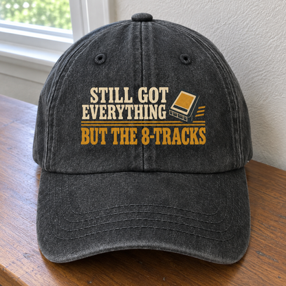 Black vintage washed cap with printed Still Got Everything But The 8-Tracks slogan, front angle view