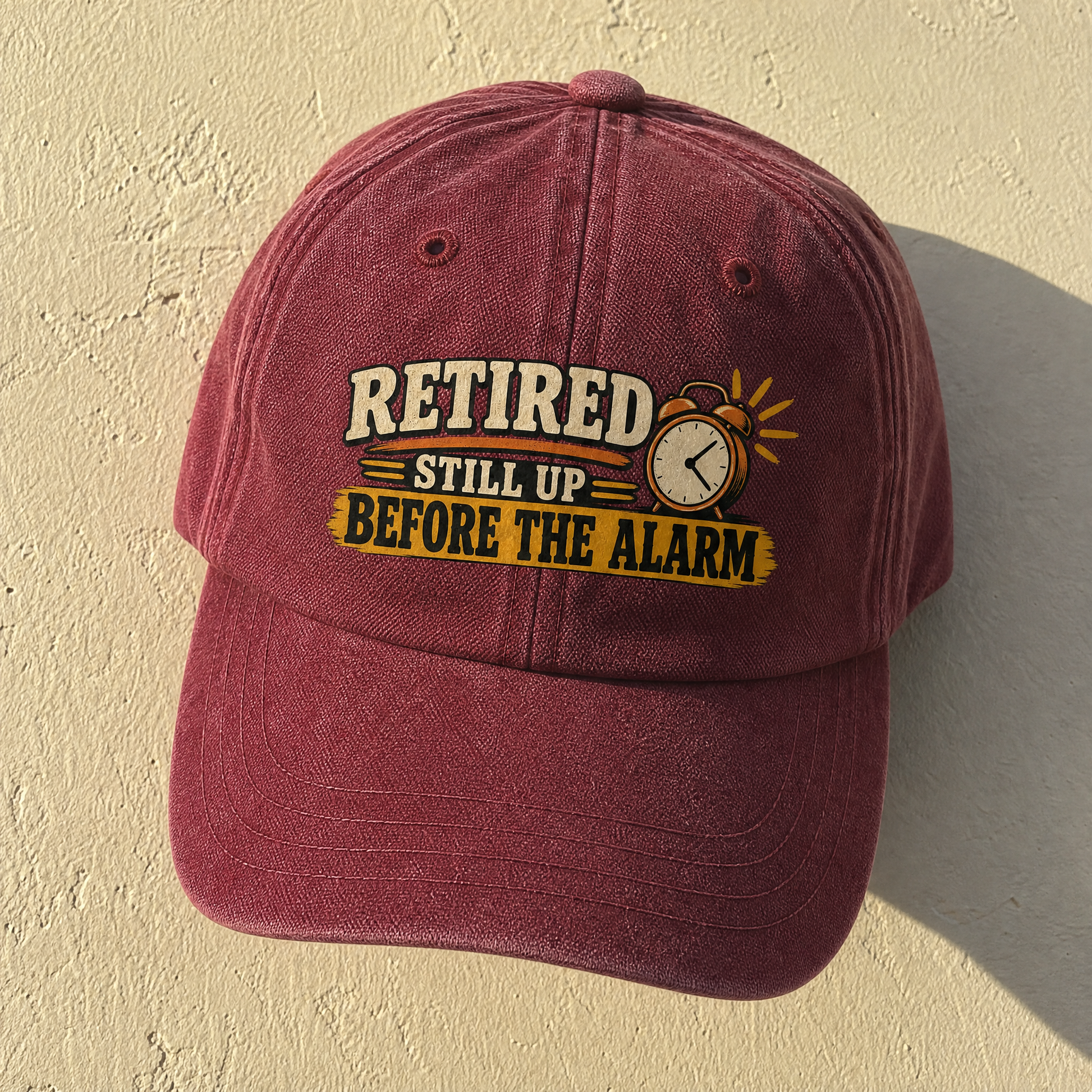 Burgundy vintage washed cap with printed Retired Still Up Before The Alarm slogan front angle
