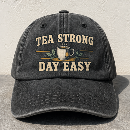 Black vintage washed cap with printed Tea Strong Day Easy slogan front angle