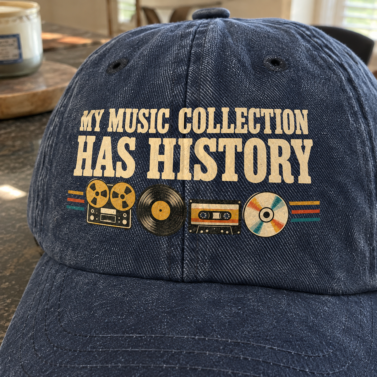 Vintage washed cap with printed “My Music Collection Has History” slogan, shown at an angle.