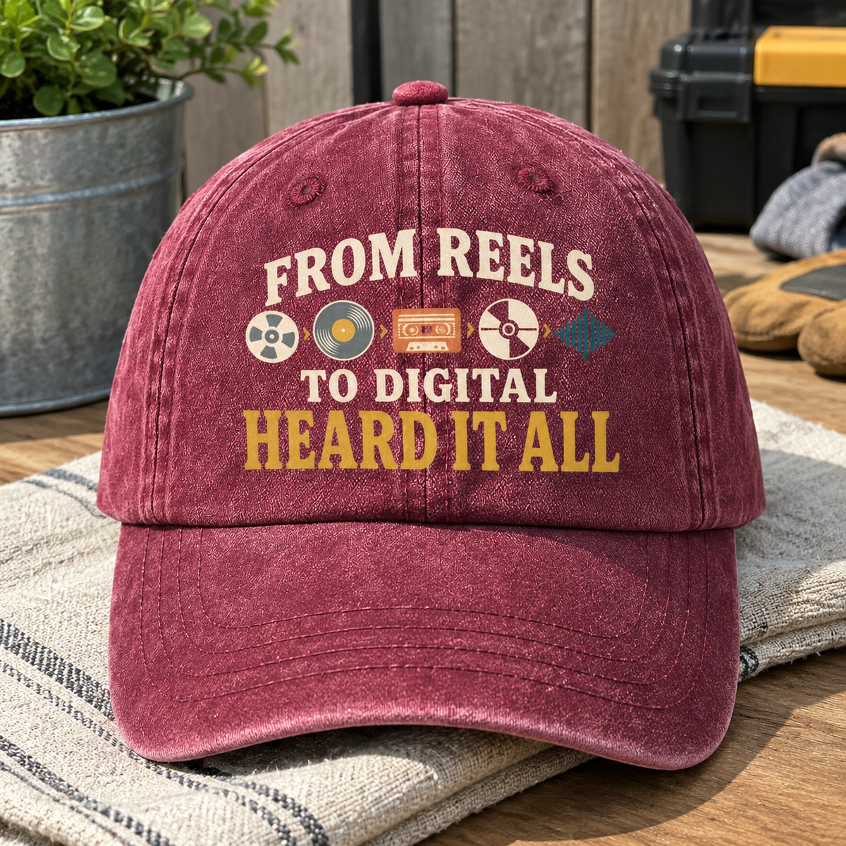 Burgundy vintage washed cap with printed From Reels To Digital Heard It All slogan, front angle view