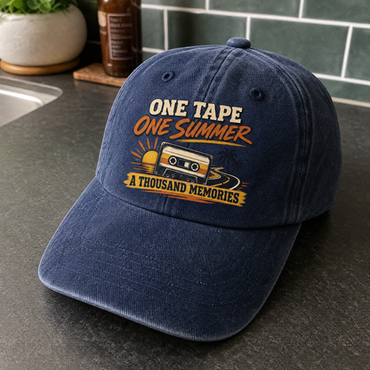 Navy vintage washed cap with printed One Tape One Summer A Thousand Memories design, angled.