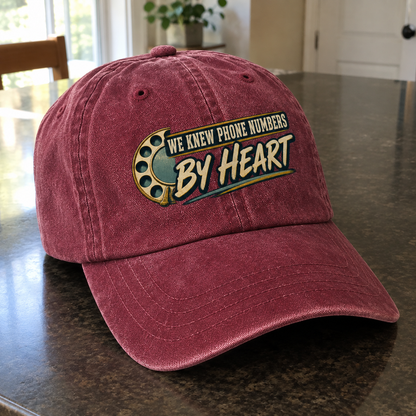 Burgundy vintage washed cap with printed We Knew Phone Numbers By Heart design, angled view
