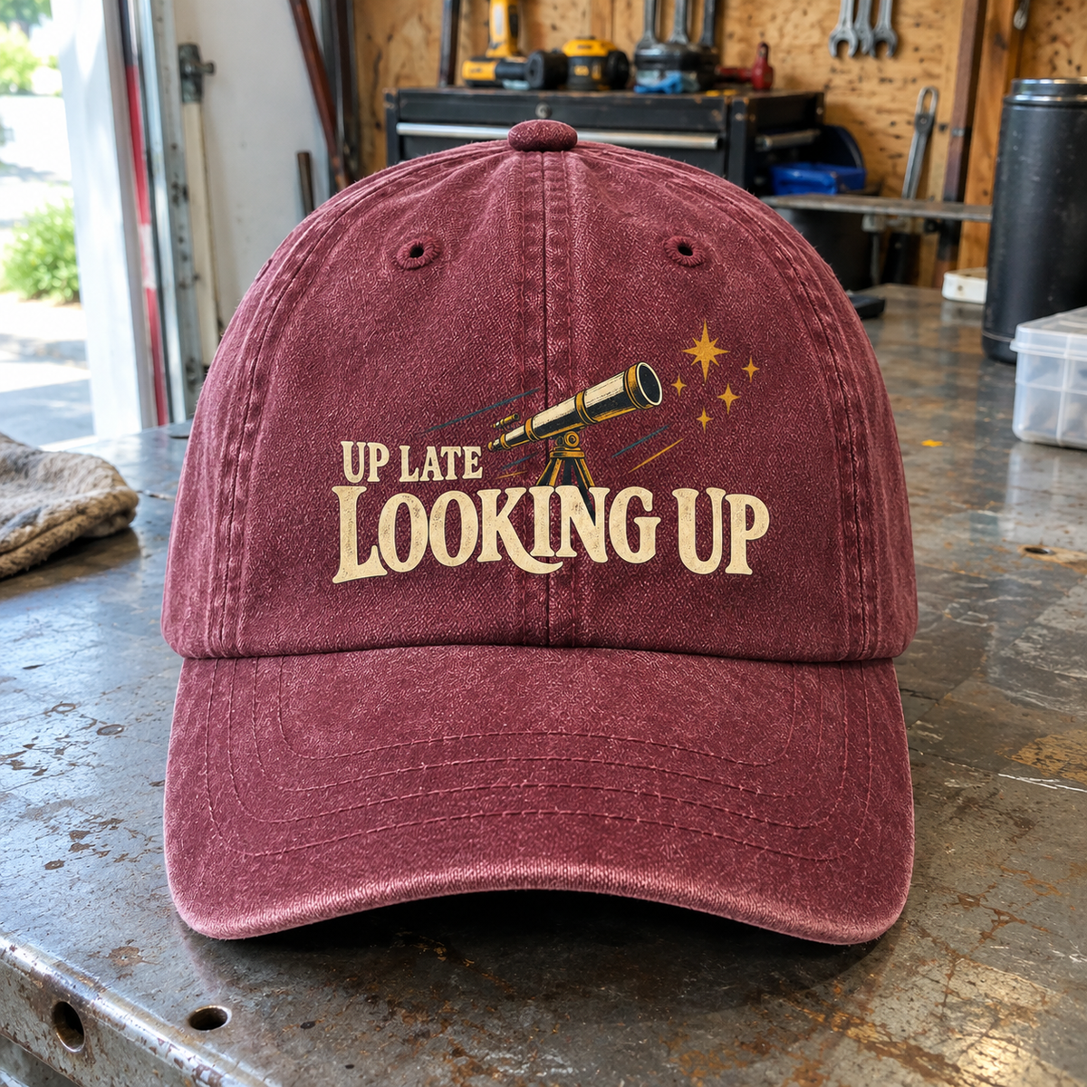 Burgundy vintage washed cap with printed Up Late Looking Up telescope design, front angle view