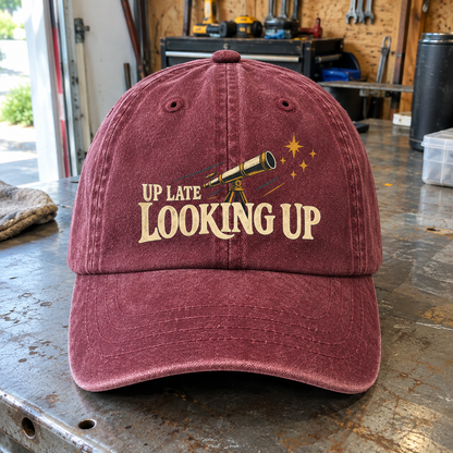 Burgundy vintage washed cap with printed Up Late Looking Up telescope design, front angle view
