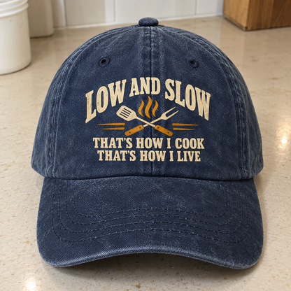 Vintage washed cap in navy with printed Low And Slow cooking slogan, front angle view