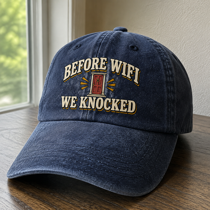 Navy vintage washed cap with printed Before Wifi We Knocked slogan, angled view