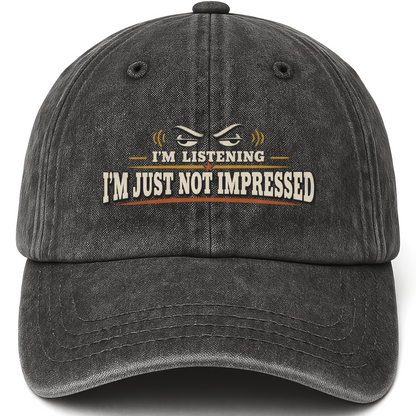 Black vintage washed cap with I'm Listening I'm Just Not Impressed printed front design