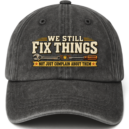 Black vintage washed cap with We Still Fix Things Not Just Complain About Them printed front design