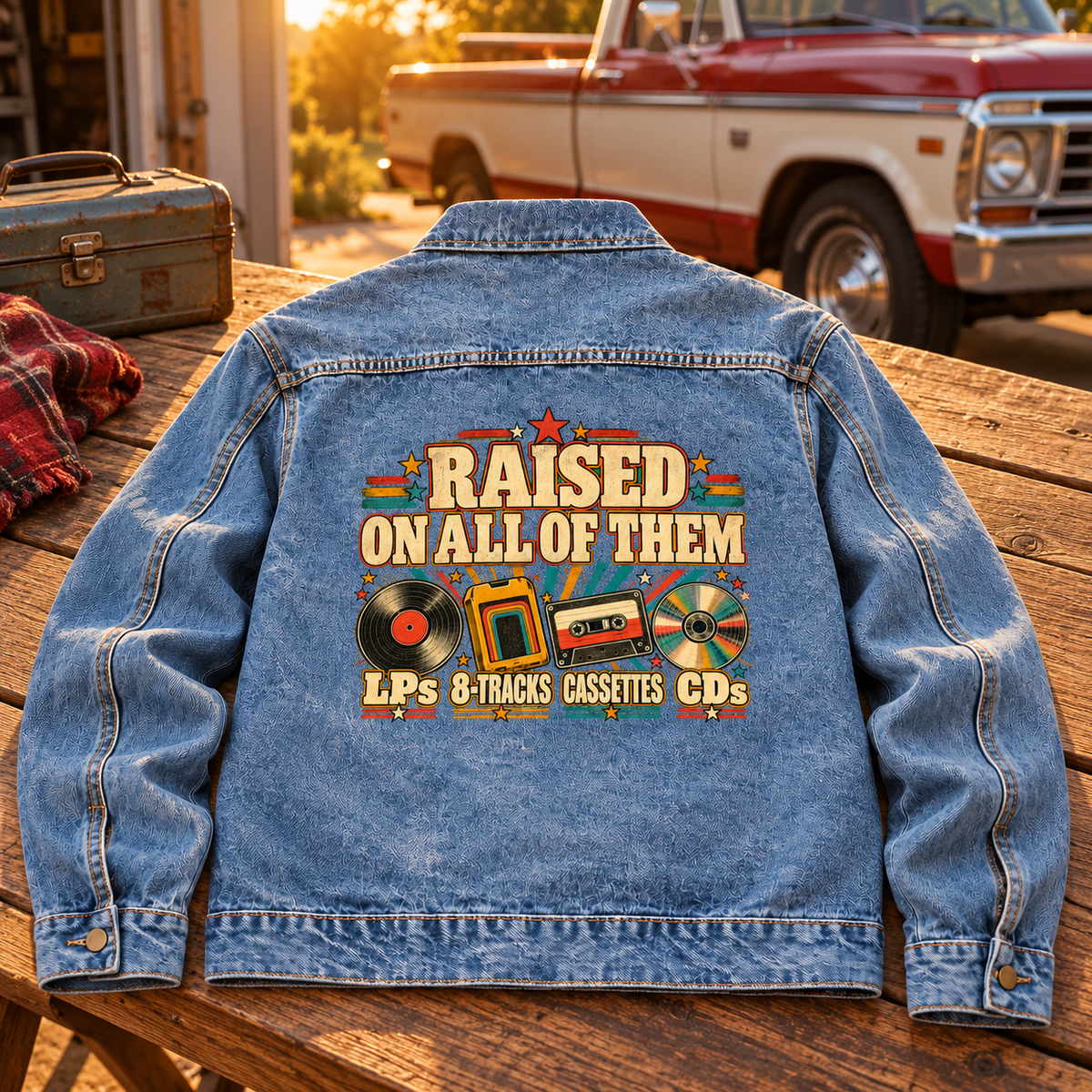 Back view of blue vintage denim jacket with printed Raised On All Of Them design