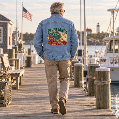 Senior man wears blue vintage denim jacket with printed Paper Maps design on dock