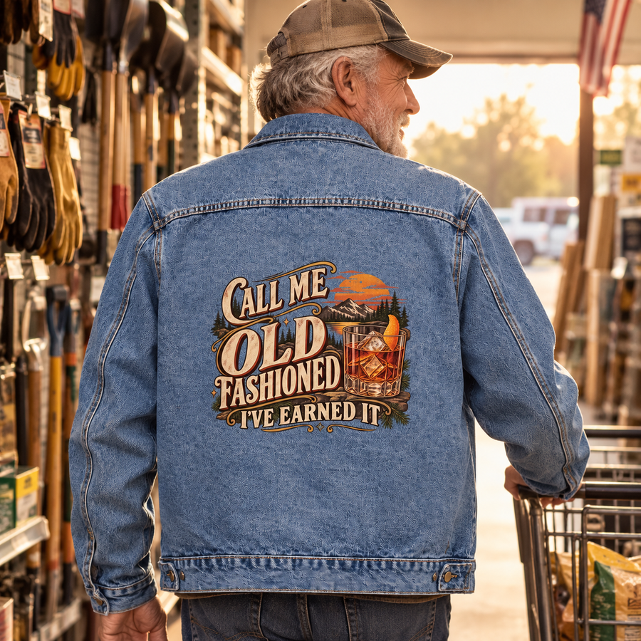 Senior man wears blue vintage denim jacket printed Call Me Old Fashioned. I've Earned It