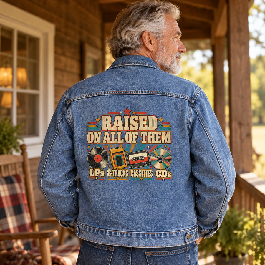 Senior man wears blue vintage denim jacket with Raised On All Of Them back print
