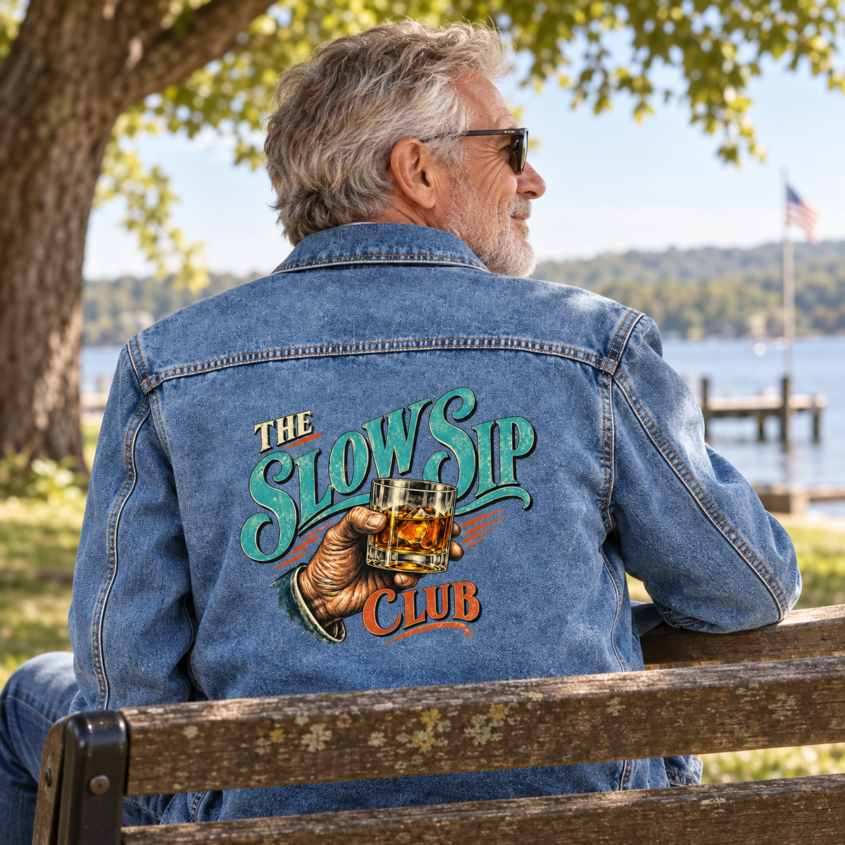 Senior man in blue vintage denim jacket with printed The Slow Sip Club design