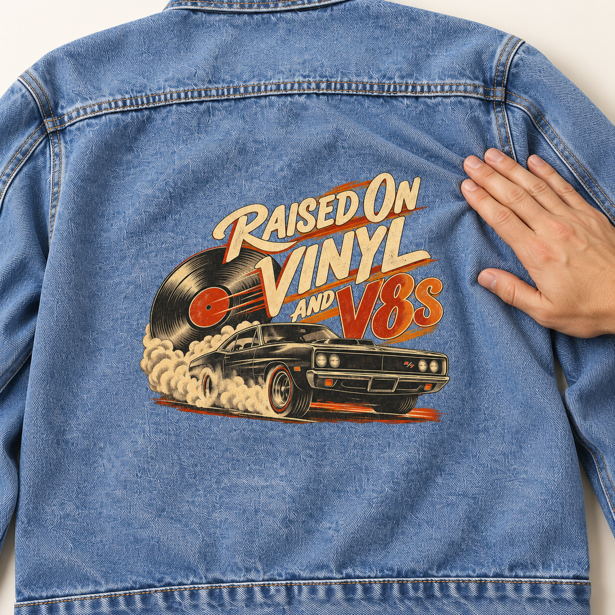 Close-up of Raised on Vinyl and V8s printed design on the back of vintage denim jacket
