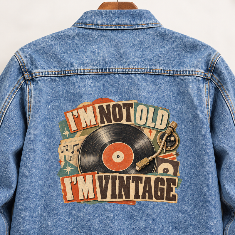 Blue vintage denim jacket back with printed I'm Not Old. I'm Vintage record design