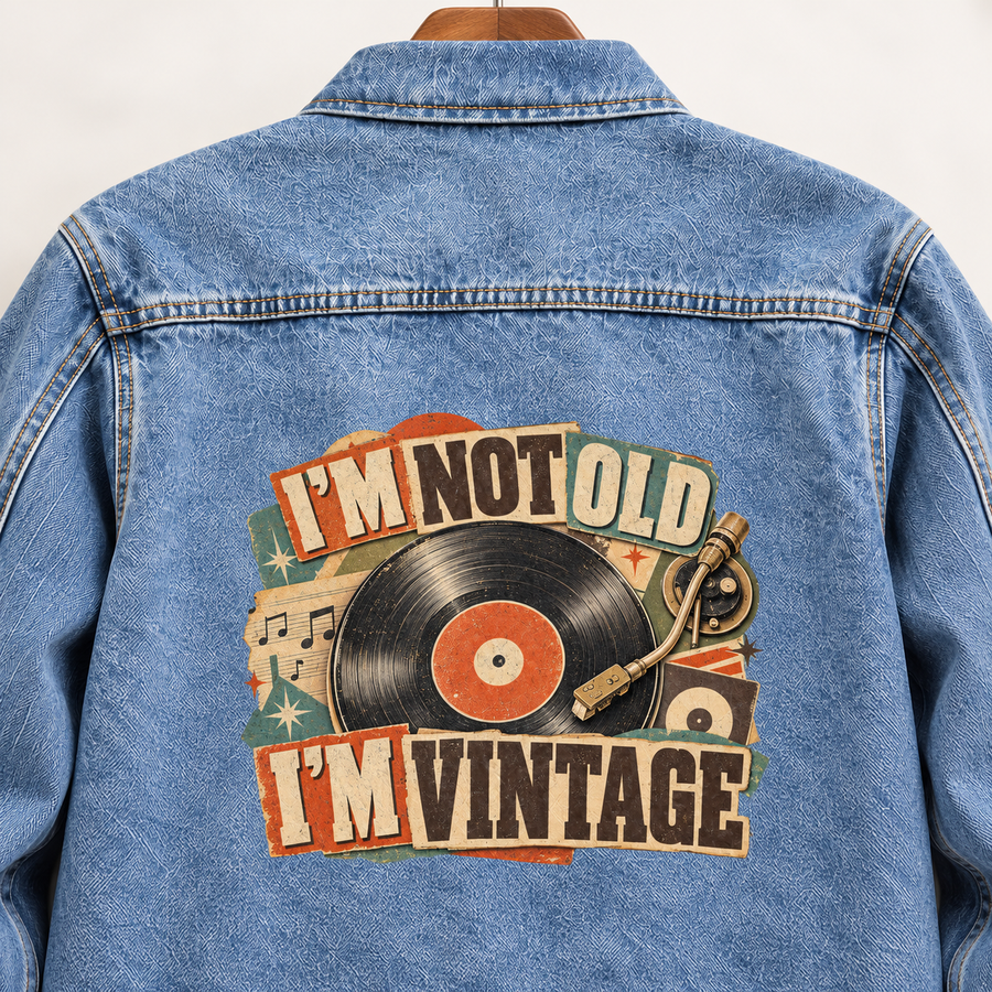 Blue vintage denim jacket back with printed I'm Not Old. I'm Vintage record design