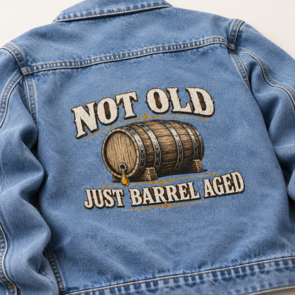 Blue vintage denim jacket back with printed barrel and Not Old. Just Barrel Aged