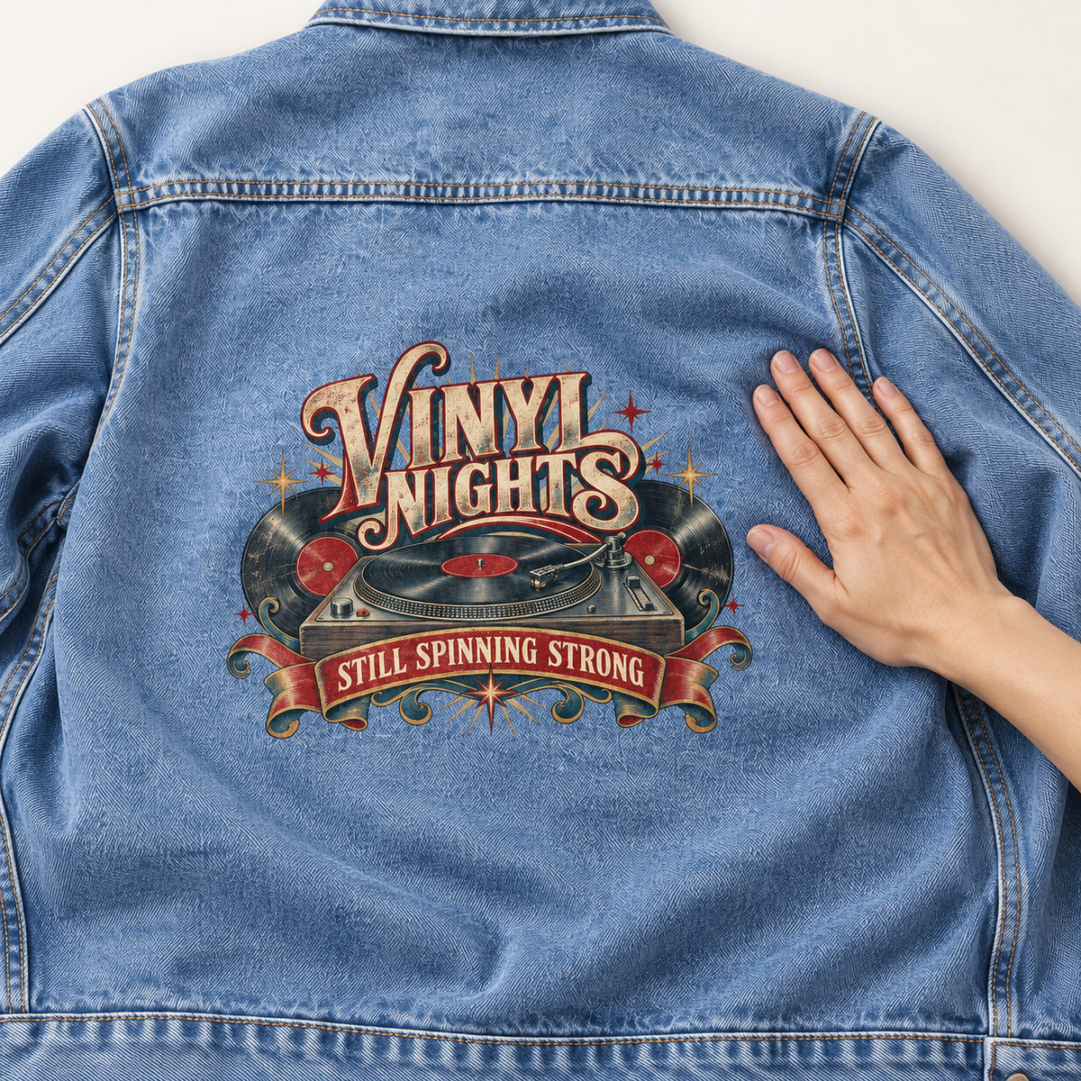 Close-up of Vinyl Nights Still Spinning Strong printed design on the back of vintage denim jacket