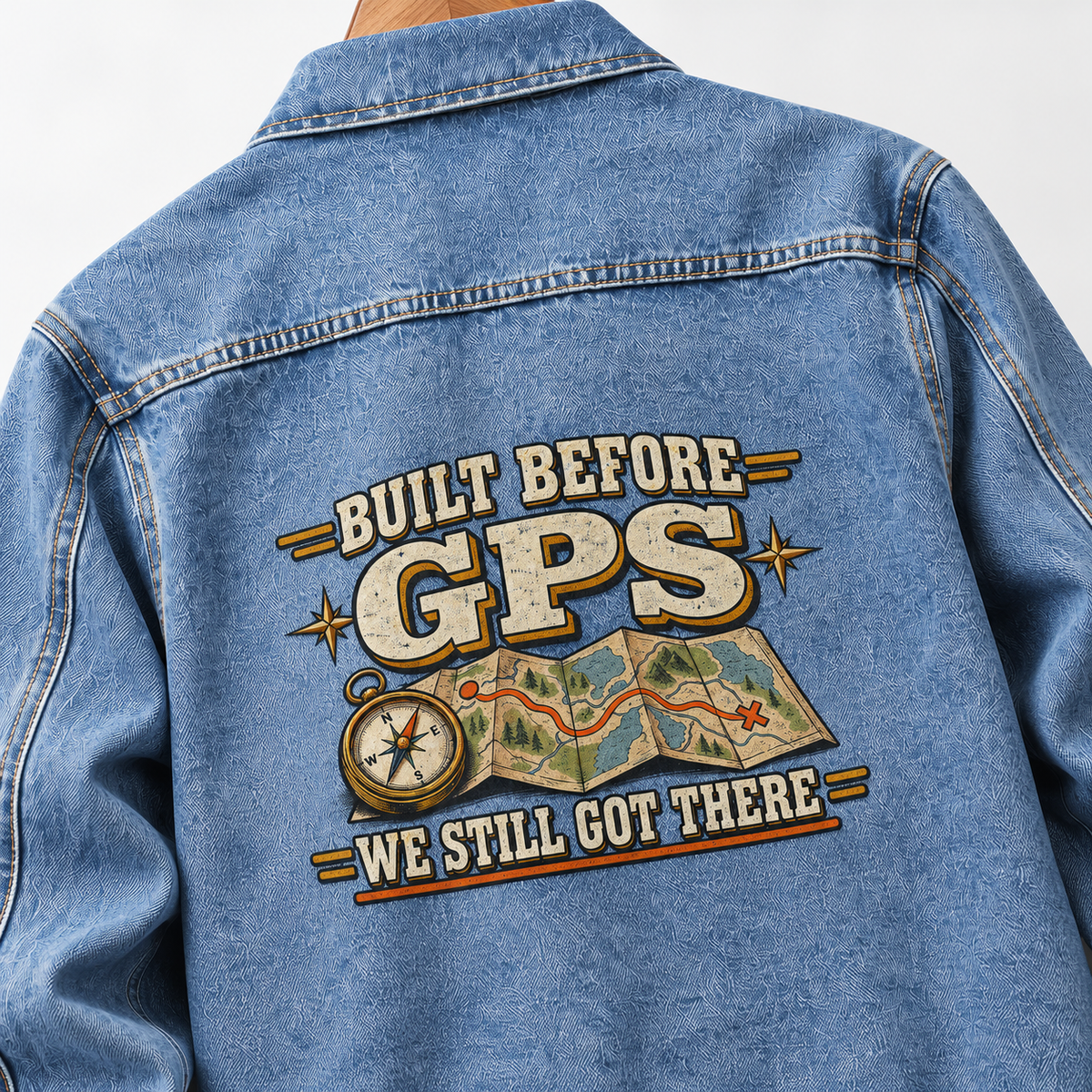 Blue vintage denim jacket back with printed map, compass, and Built Before GPS. We Still Got There