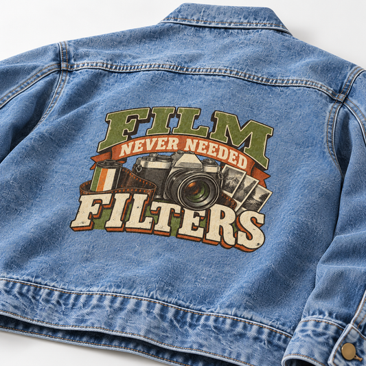 Back view of blue vintage denim jacket with printed Film Never Needed Filters camera design