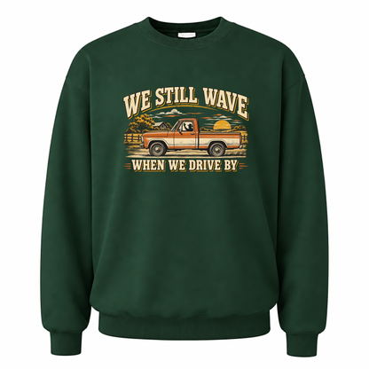 Forest Green vintage sweatshirt with We Still Wave When We Drive By printed front design