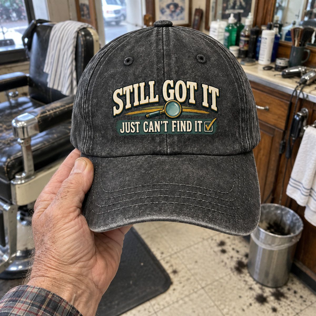 Black vintage washed cap held up, printed Still Got It Just Can't Find It