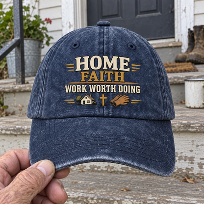 Handheld navy vintage washed cap with printed Home Faith Work Worth Doing slogan