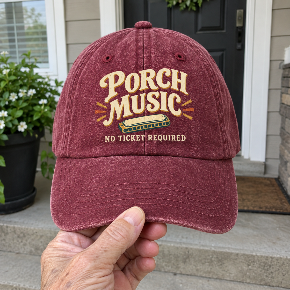 Vintage washed burgundy cap with printed Porch Music No Ticket Required design, handheld front view