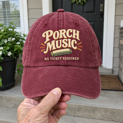 Vintage washed burgundy cap with printed Porch Music No Ticket Required design, handheld front view