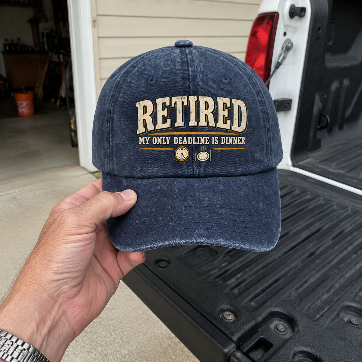 Handheld navy vintage washed cap with printed Retired My Only Deadline Is Dinner slogan