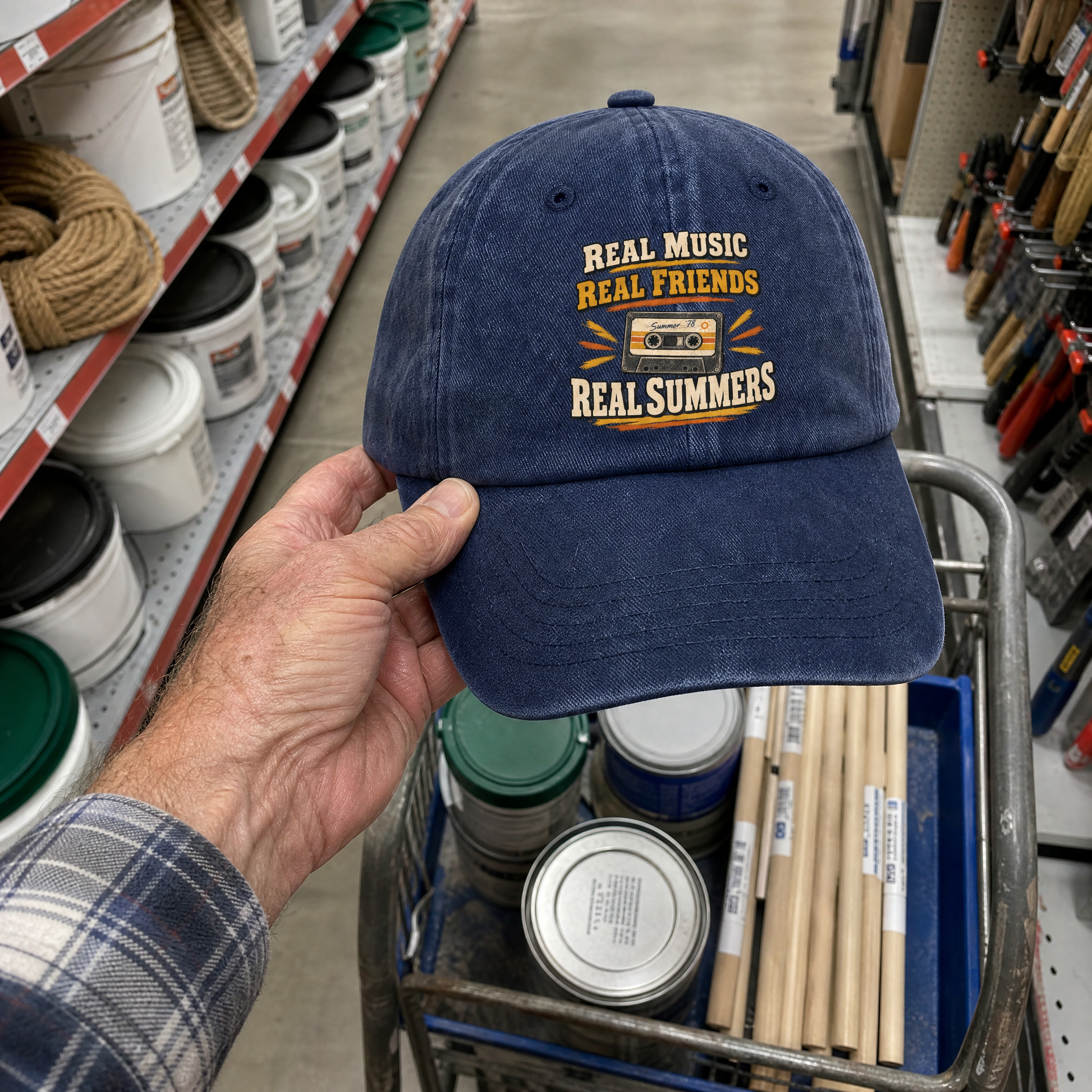 Vintage washed blue cap with printed “Real Music Real Friends Real Summers” design, handheld view