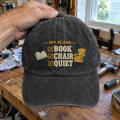 Black Vintage Washed Cap With Printed My Plans Book Chair Quiet Design, Handheld Front View
