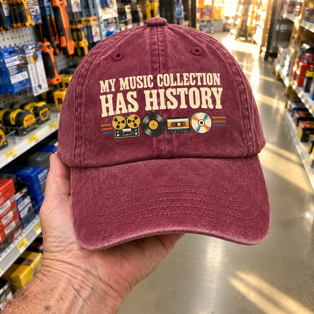 Burgundy vintage washed cap with printed “My Music Collection Has History” slogan and retro records