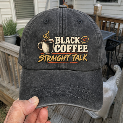 Hand holding vintage washed cap with Black Coffee. Straight Talk printed design