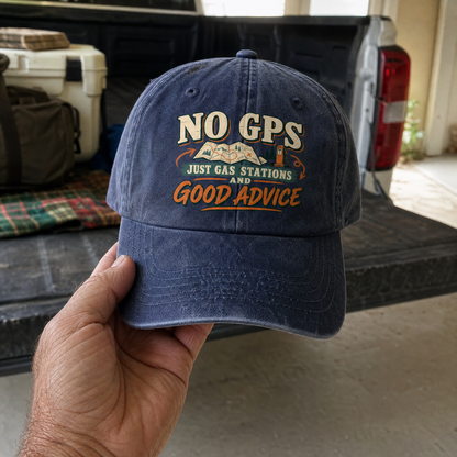 Blue vintage washed cap with printed “No GPS Just Gas Stations And Good Advice” slogan, handheld view