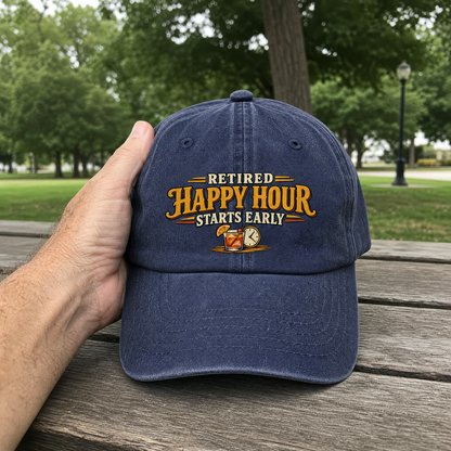 Navy vintage washed cap with printed “Retired Happy Hour Starts Early” slogan, handheld outdoor view