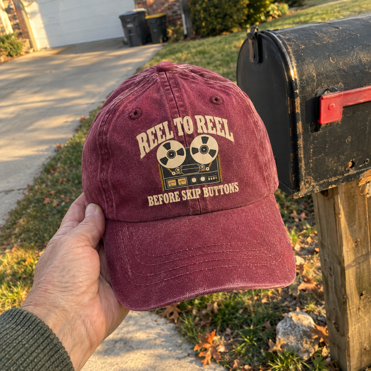 Burgundy vintage washed cap featuring printed Reel To Reel Before Skip Buttons slogan and tape design