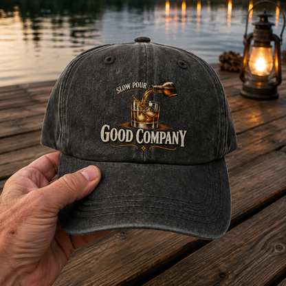 Black vintage washed cap with printed Slow Pour Good Company design held outdoors