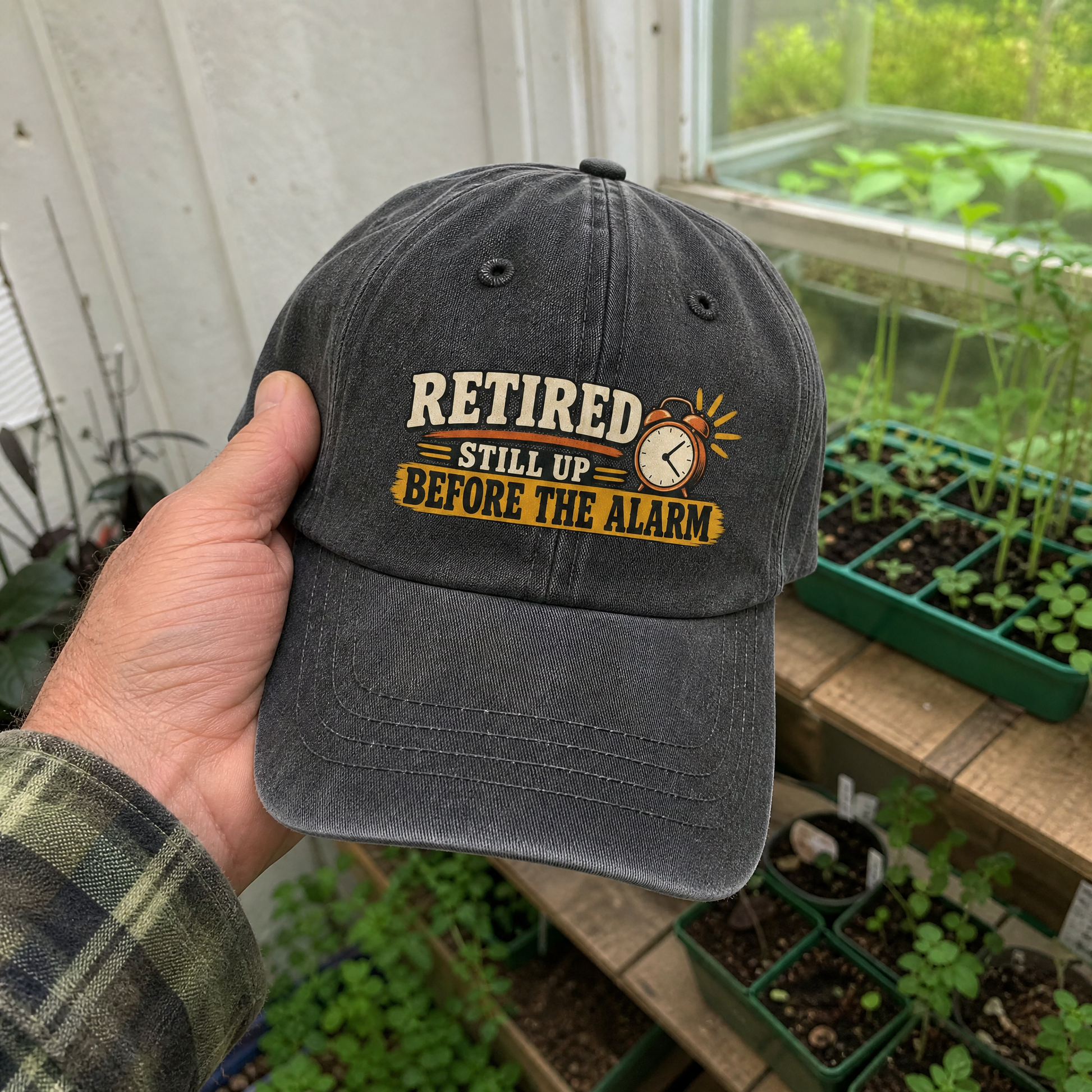 Black vintage washed cap with printed Retired Still Up Before The Alarm slogan, handheld view