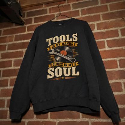 Hanging vintage sweatshirt with printed 34 tools in my hands oldies in my soul design
