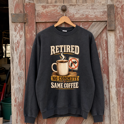 Black vintage sweatshirt hanging with printed Retired. No Commute Same Coffee slogan and coffee design.