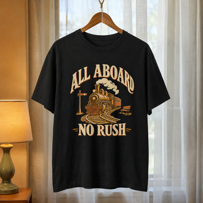 Black vintage t-shirt hanging with printed steam train design and All Aboard No Rush slogan