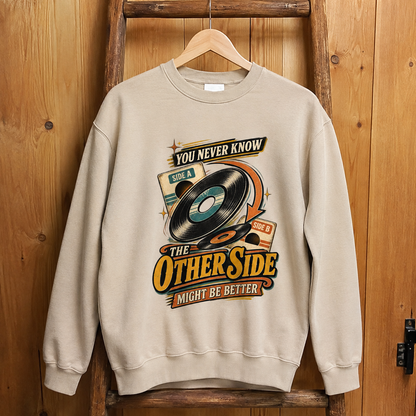 Vintage sweatshirt hanging with printed You Never Know The Other Side Might Be Better design