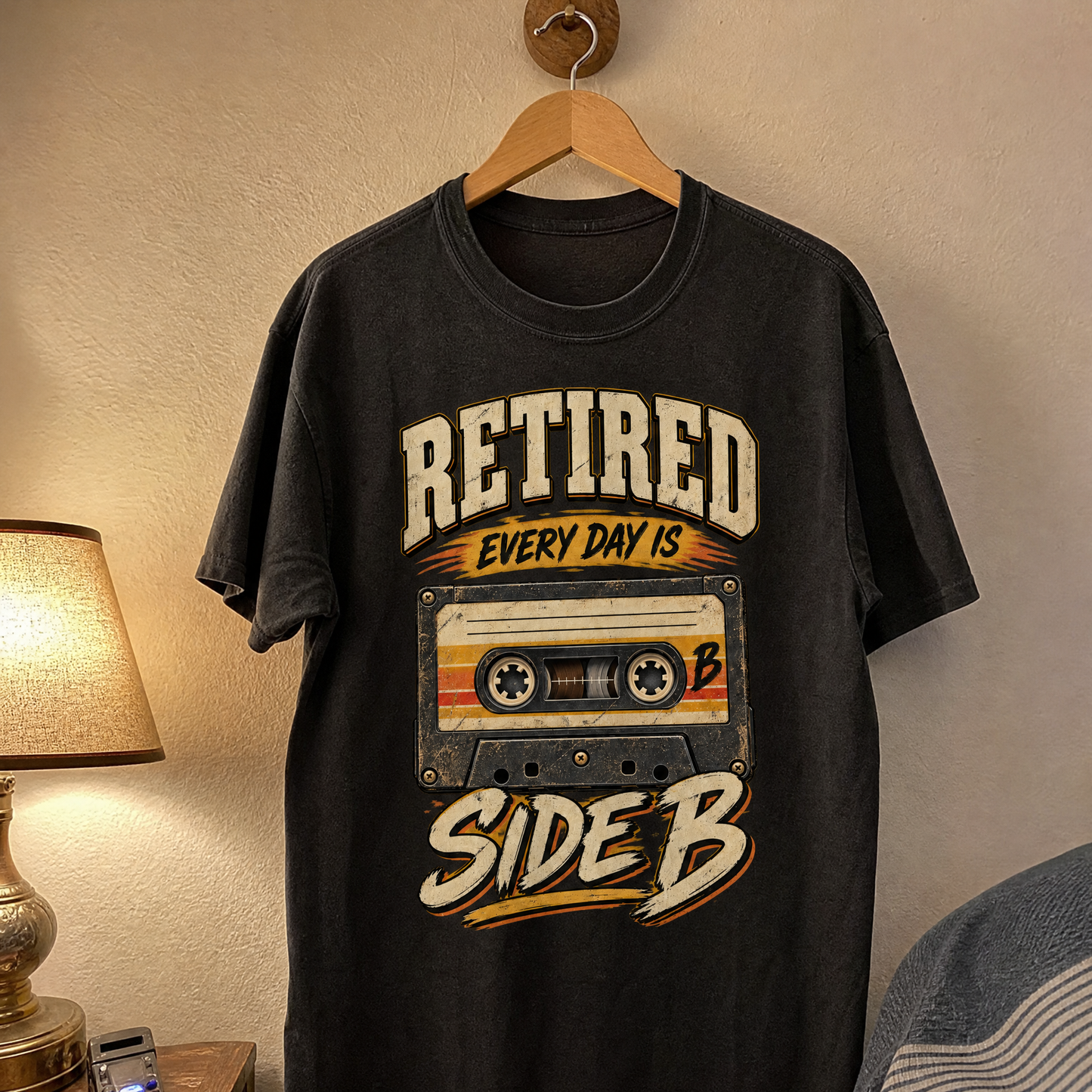 Vintage t-shirt hanging, featuring printed “38 every day is side b” design in bold lettering