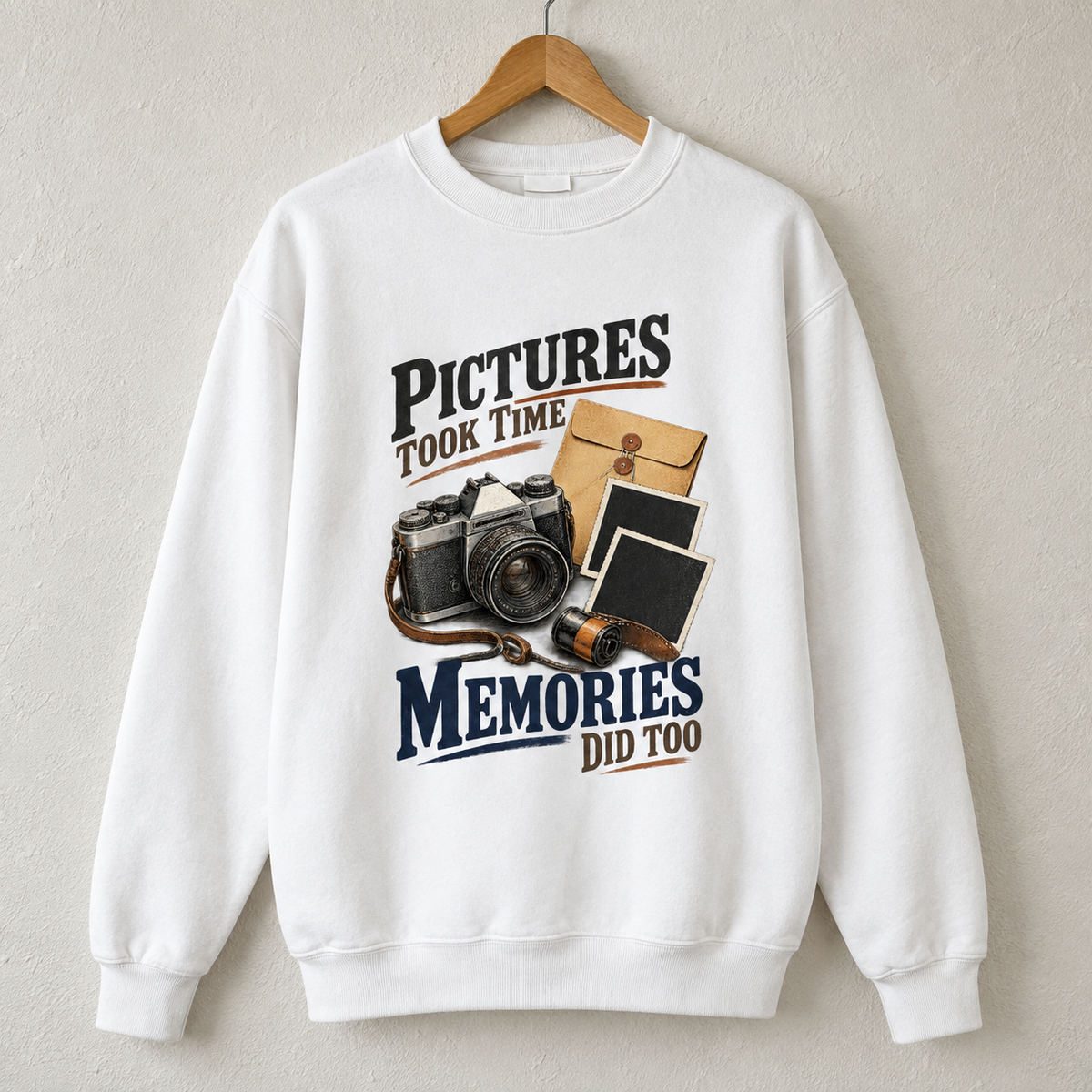 White vintage sweatshirt hanging with Pictures Took Time. Memories Did Too slogan and camera graphic