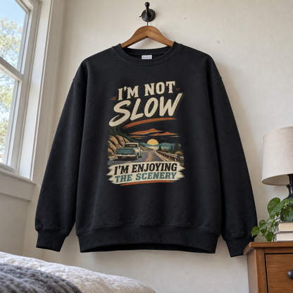 Black vintage sweatshirt hanging with printed I'm Not Slow I'm Enjoying The Scenery slogan