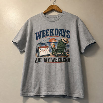 Gray vintage t-shirt hanging with printed Weekdays Are My Weekend slogan and lakeside design