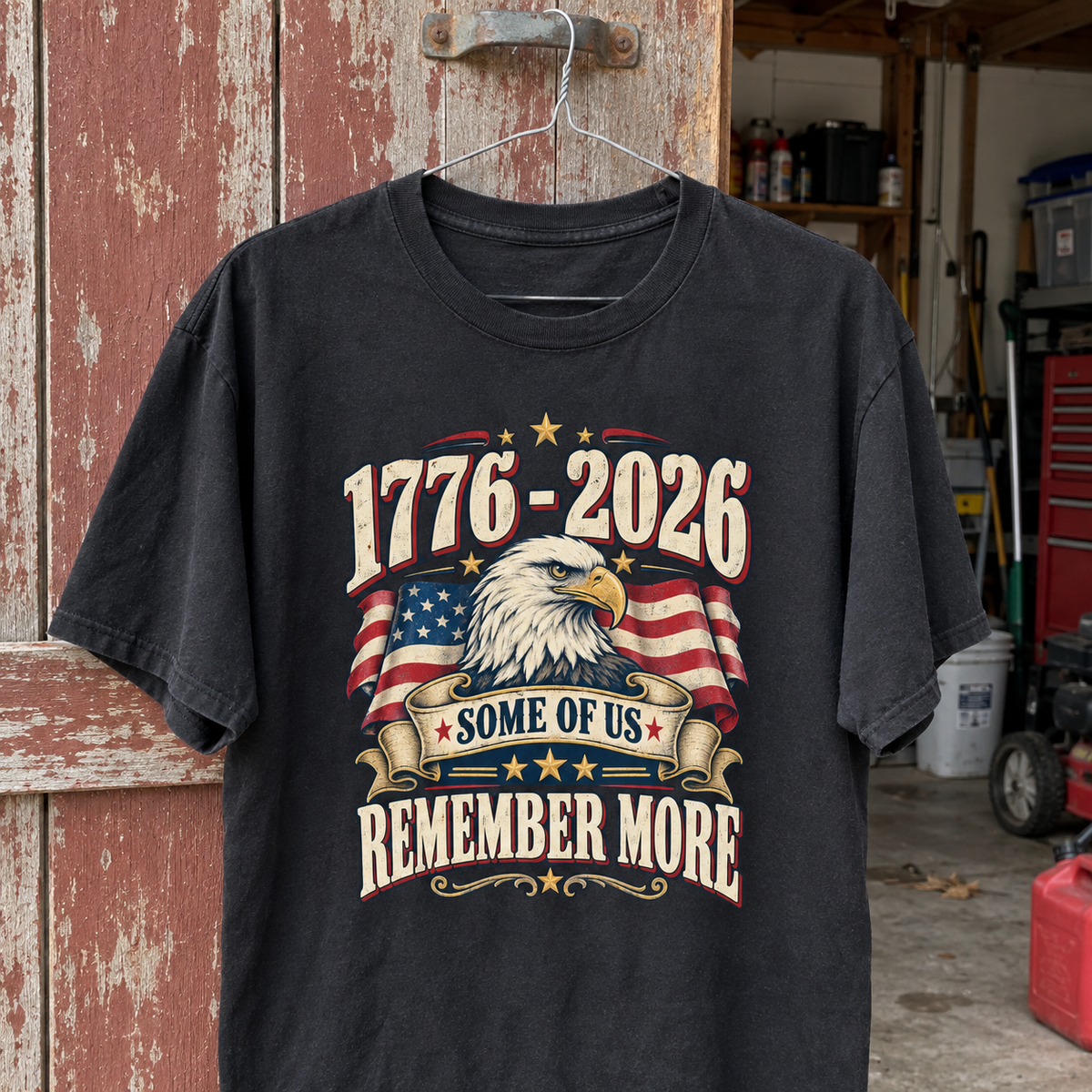 Black vintage t-shirt hanging, printed 1776-2026 Some Of Us Remember More with eagle and flag