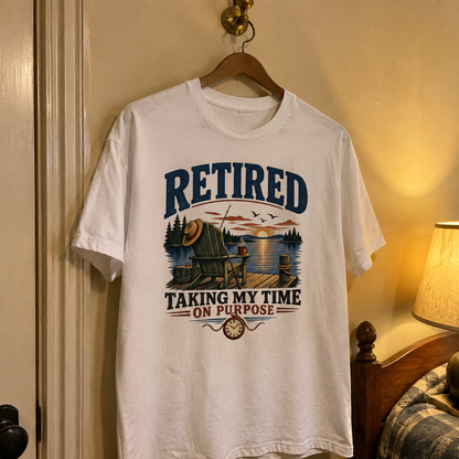 White vintage t-shirt hanging with printed Retired Taking My Time On Purpose lake design